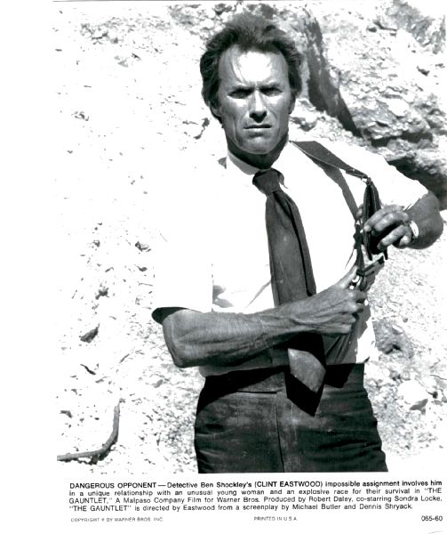 Publicity Photo/Still: CLINT EASTWOOD - GAUNTLET, THE 1977 Putting Away Gun Publicity Photo/Still: CLINT EASTWOOD - GAUNTLET, THE 1977 Putting Away Gun