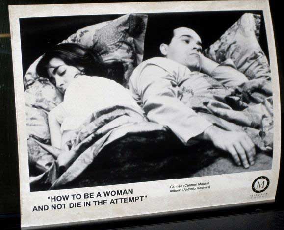 HOW TO BE A WOMAN AND NOT DIE IN THE EVENT: Publicity Still Couple in Bed 